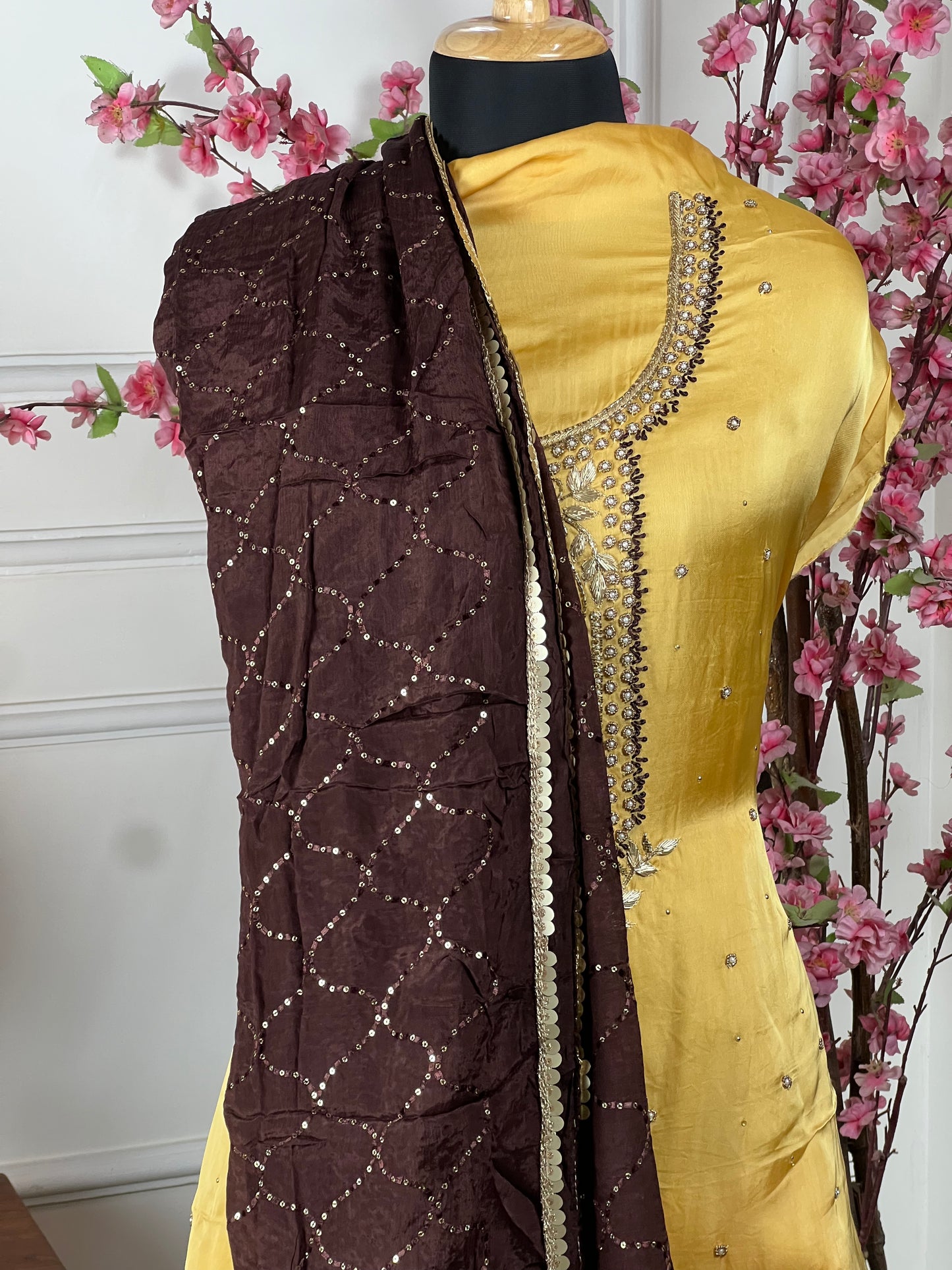 Top: Silk satin with handwork dabka and pearl work golden colour on neck; Bottom: Pure upada silk (coffee); Dupatta: Pure chinon sequin work with heavy lace in coffee colour;