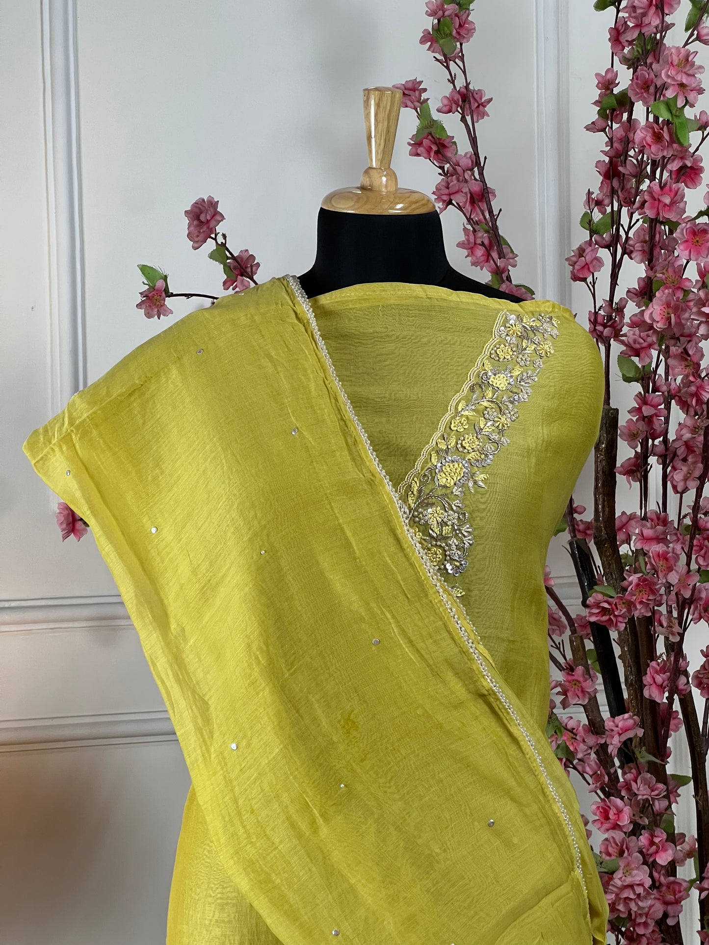Top: Pure mul chanderi soft with pearl knot, dabka thread work on neck; Bottom: Pure soft muslin santoon; Dupatta: Pure mul chanderi sequin and pearl lace;