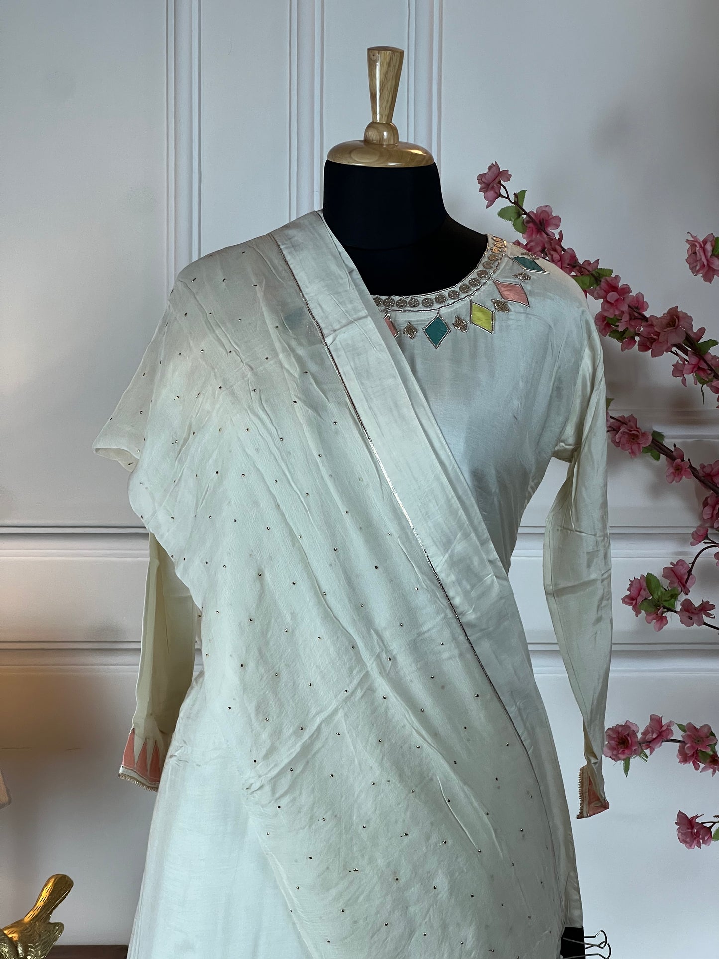 Top: Pure muslin semi-stitched with gota hand work; Bottom: Skirt stitched free size; Dupatta or stole: Pure chinon chiffon with sequin work;