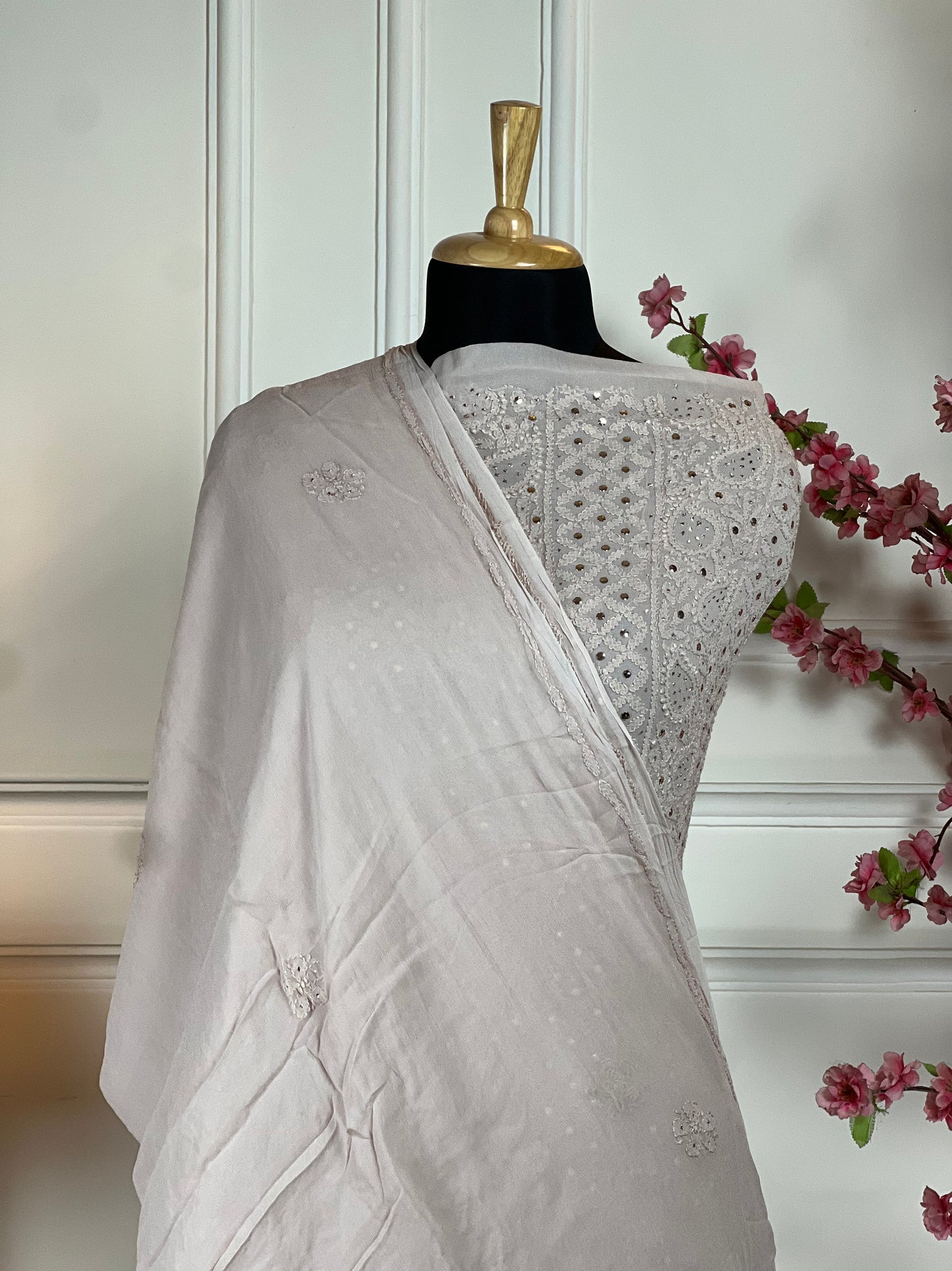 Top: Pure jorgette handwork and mukaish work on front and handwork on back (buti) and baju border; Bottom: Plain crape pant piece; Dupatta: Pure jorgette handwork and mukaish work;