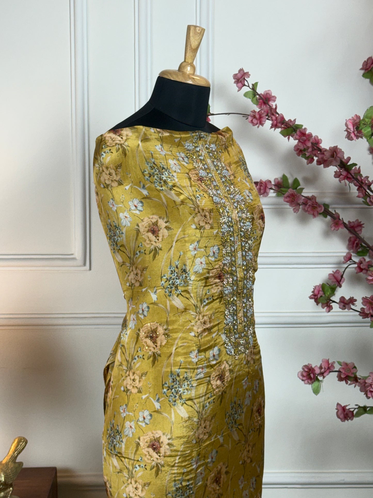 Top: Pure super soft shimmer silk printed with knot work, pearl, dabka, nalki handwork on neckline; Bottom: Pure soft upada silk; Dupatta: Pure chinon with patti, gota lace and sequin handwork;