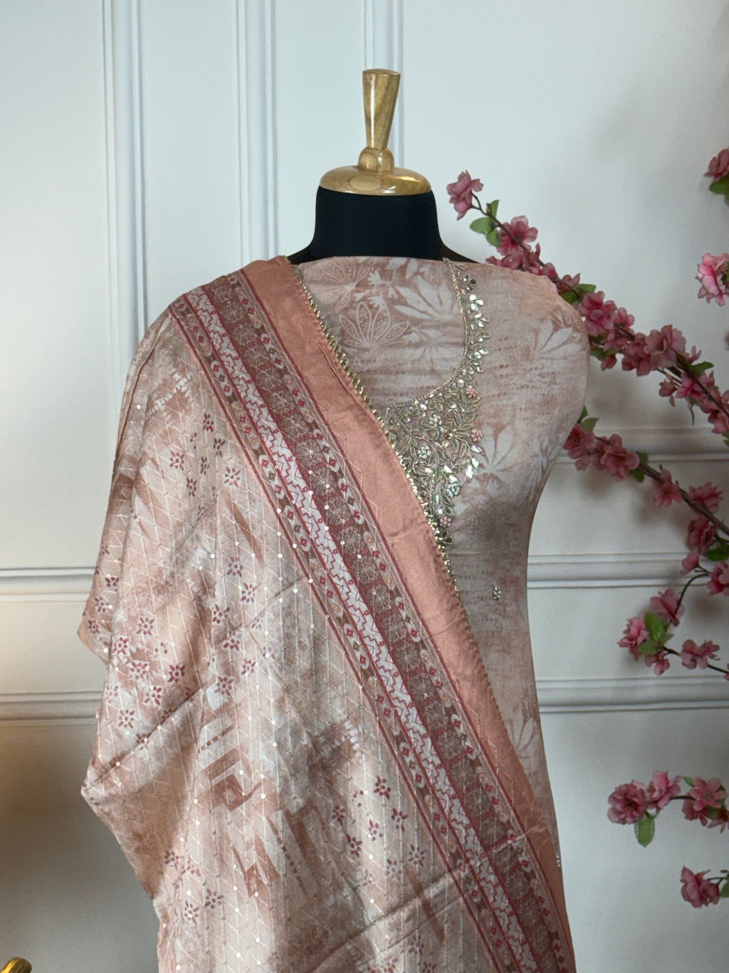 Top: Pure chiffon printed with work on neck, dabka handwork, knot work, gota patti, dori, sequin, pearl work and buti on front; Bottom: Pure super soft opada; Dupatta: Pure chiffon sequin and thread work with printed border and heavy tassels;
