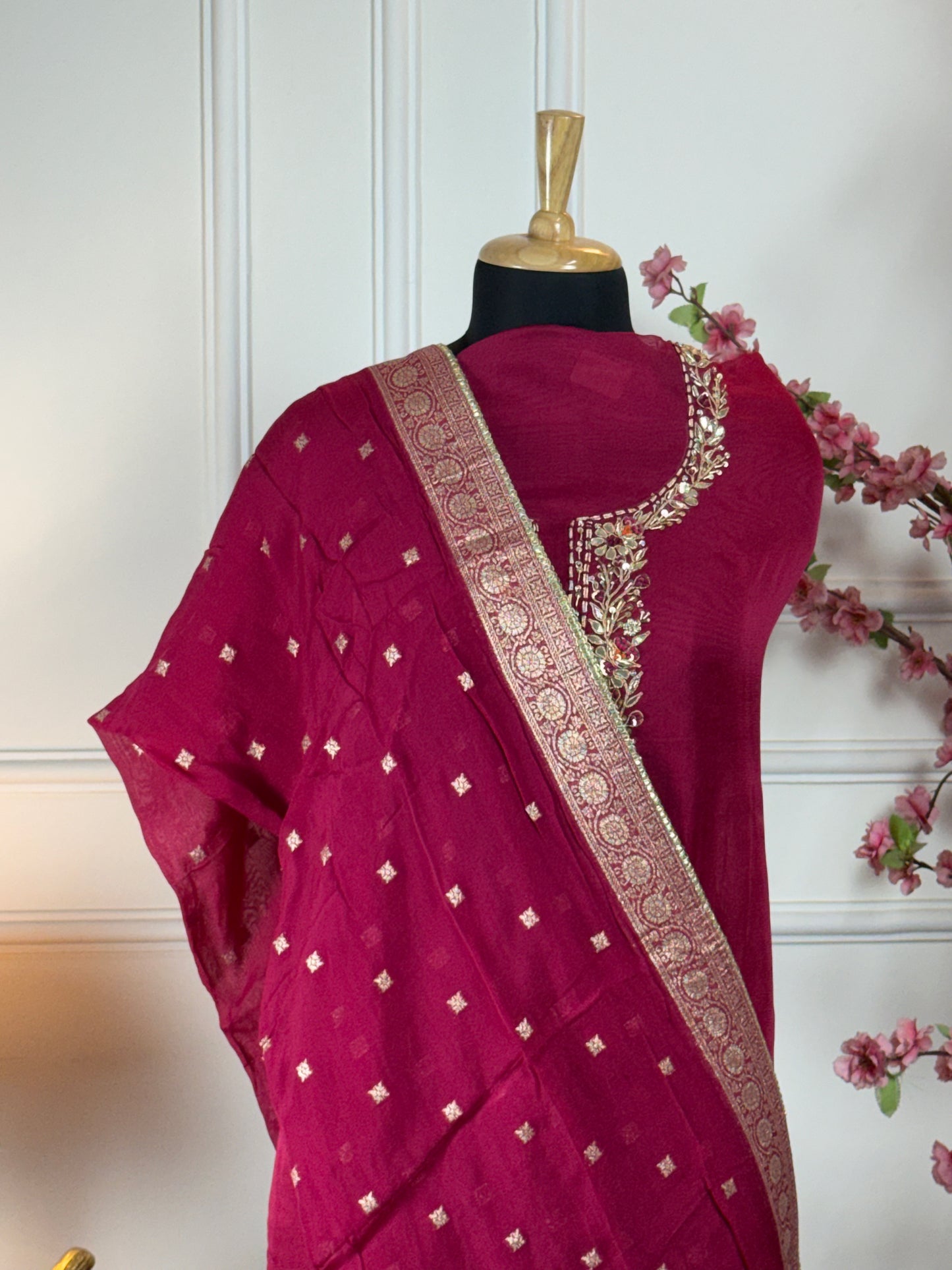 Top: Pure Burbary silk with dori, gota patti, dabka, sequins, knot work on neck; Bottom: Pure opada silk soft; Dupatta: Pure organja with Banarasi buti and border and tassels;