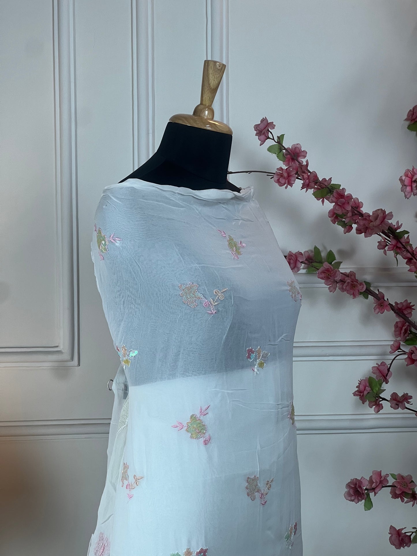 Top: Pure jorgette with multicolour sequins and thread work on border; Bottom: Pure heavy silk santoon; Dupatta: Pure jorgette with heavy sequins border and buti;