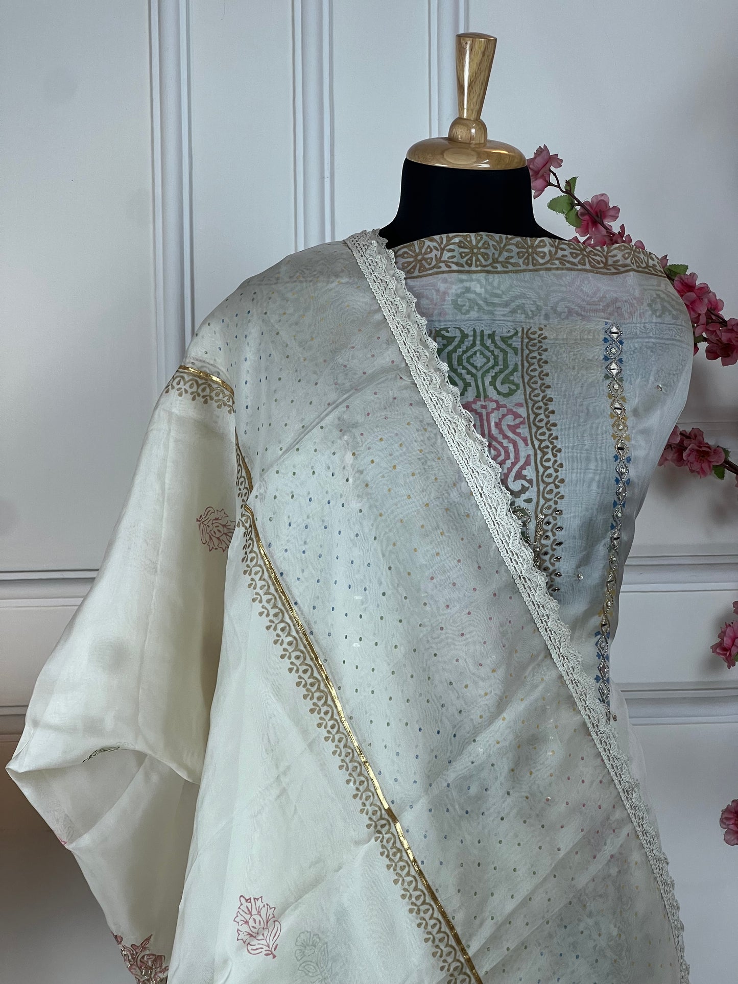 Top: Pure organja silk designer print and highlight on print with chain stitch highlights; Bottom: Pure muslin; Dupatta: Pure organja same print and work on dupatta;