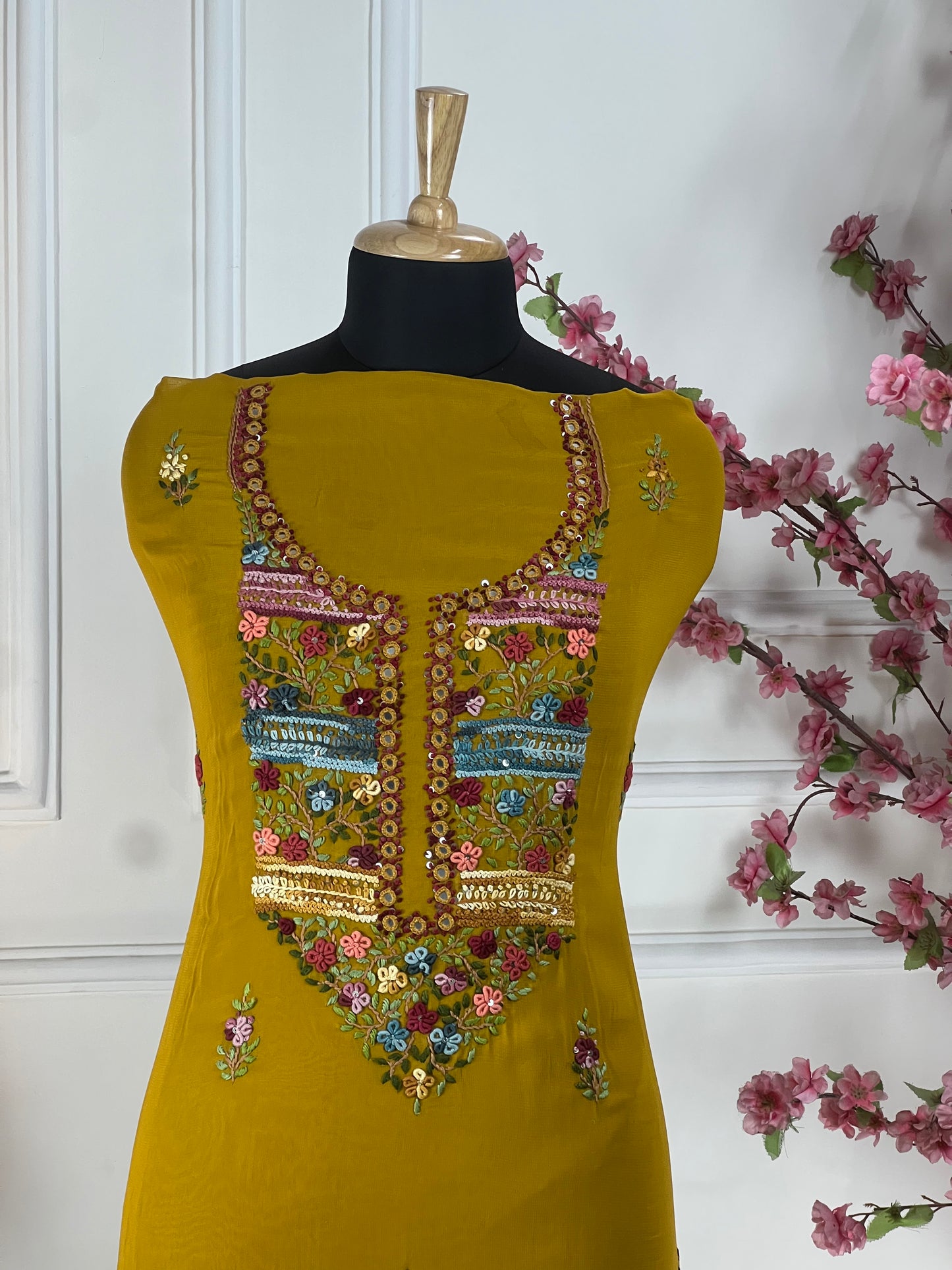 Top Pure jorgette thread and sequins hand work on neck and front Bottom Pure heavy santoon silk Dupatta Pure jorgette thread work and tassels